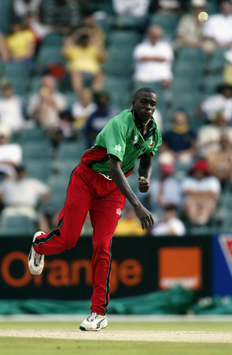 Collins Obuya of Kenya bowling