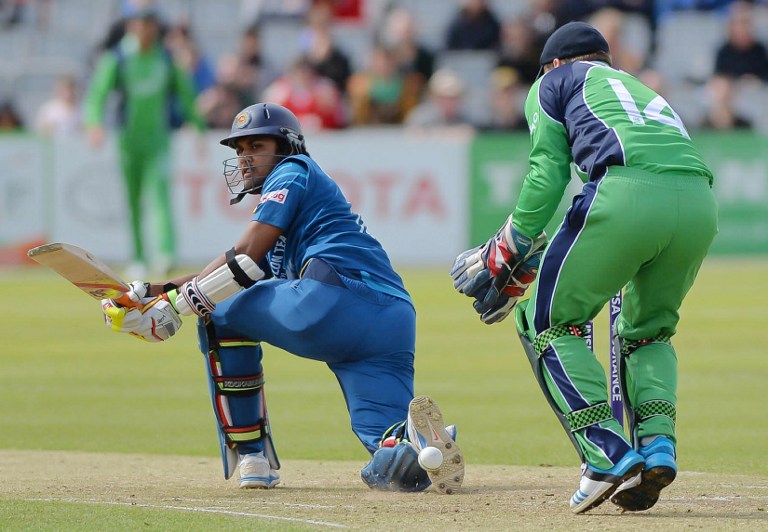 Sri Lanka's Dinesh Chandimal (L) bats during a One Day International cricket match between Ireland and Sri Lanka at Clontarf Cricket Club in Dublin, Ireland, on May 6, 2014. AFP PHOTO / ARTUR WIDAK